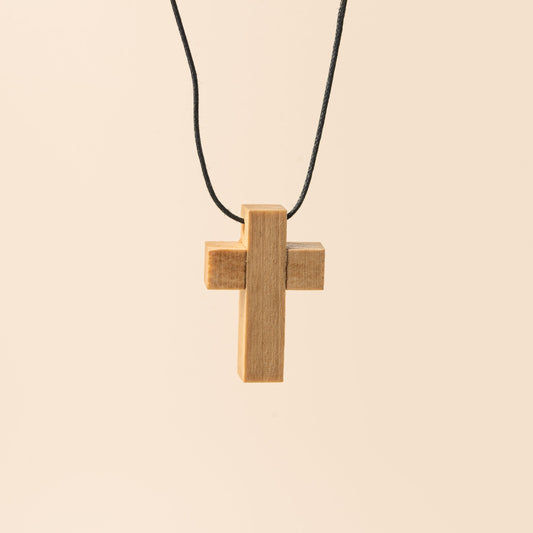 Cross pendant on cord