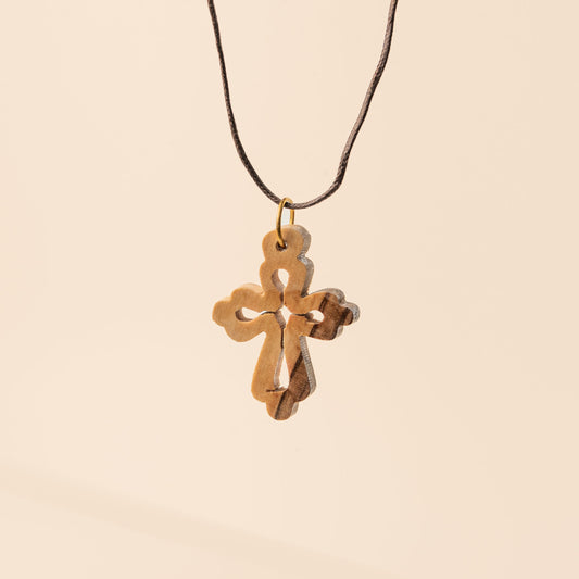 Oriental cross pendant on cord
